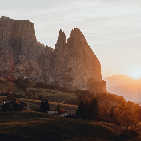 Sensoria Soulmates – Creating Memories of Bliss Sunrise over mountains with houses and meadows in the foreground