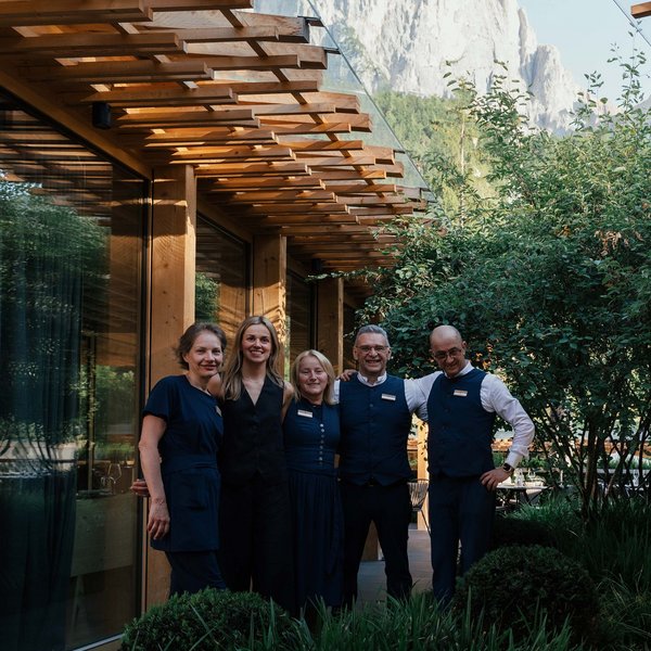 Sensoria Soulmates – Creating Memories of Bliss Five staff members in front of a wooden building with mountain in the background