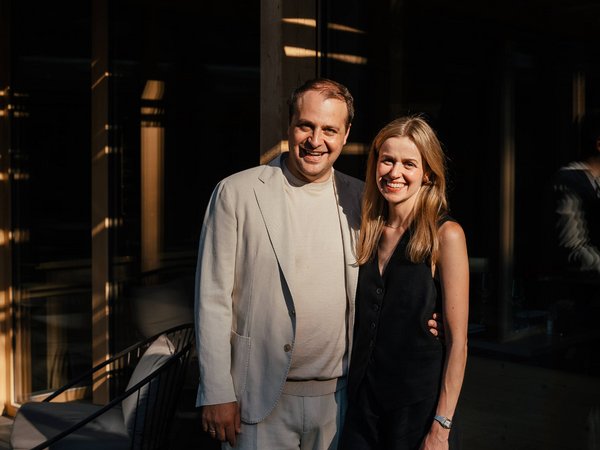 Sensoria Soulmates – Creating Memories of Bliss Couple smiling together outside a modern building