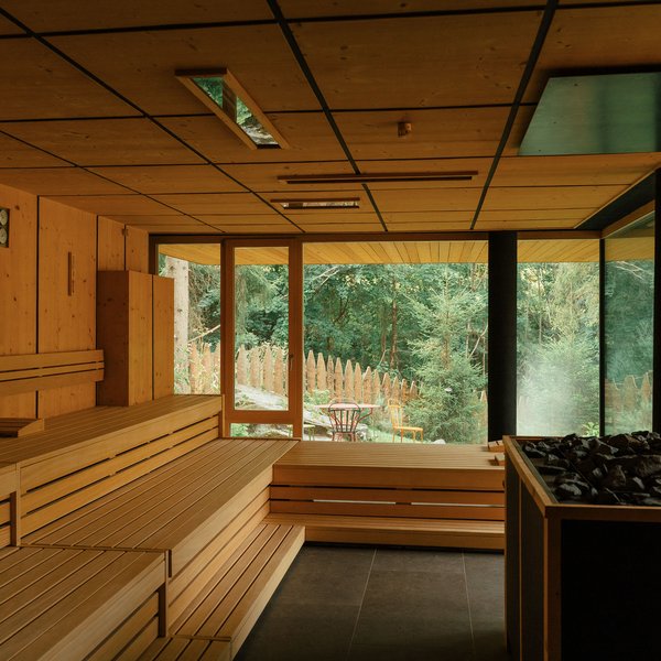 Sensoria Soulmates – Creating Memories of Bliss Sauna with wood interior and large window overlooking forest outside