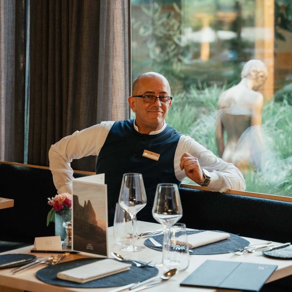 Sensoria Soulmates – Creating Memories of Bliss Waiter sitting at set table in restaurant with large window view