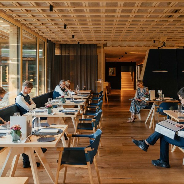 Sensoria Soulmates – Creating Memories of Bliss Interior of a restaurant with guests reading menus at tables