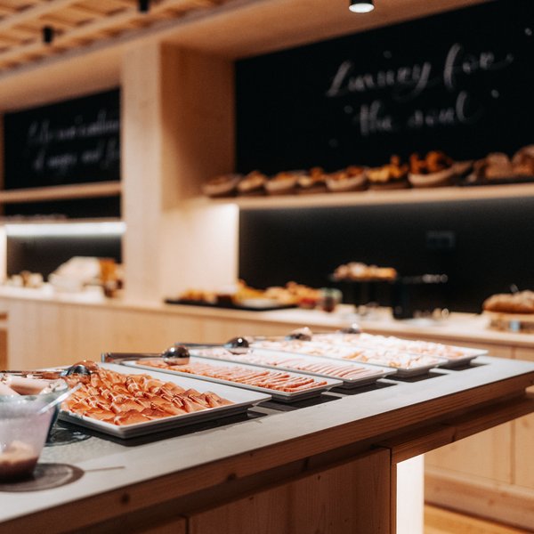 Sensoria Soulmates – Creating Memories of Bliss Buffet with cold cuts and pastries in a modern wooden restaurant